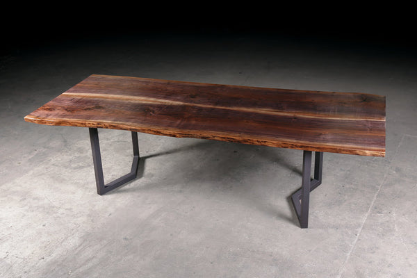 Hardwood dining tables and hardwood conference tables - Custom made live natural edge Walnut dining table and steel base. Design and handmade furniture by Urban Lumber Co.